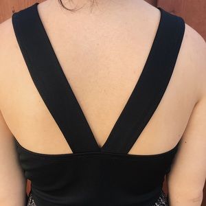 Nice, black crop top w/ cries cross back .